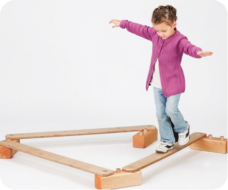 Child participating in a developmental screening activity on a balance beam.