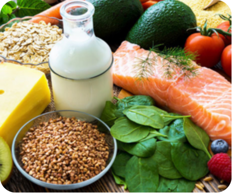 Healthy foods including fruits, vegetables, whole grains, salmon, and milk for child nutrition
