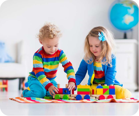 Children participating in a developmental therapy activity using colorful educational toys